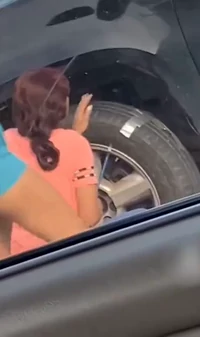 Women fixing the punctured tire